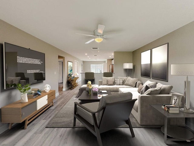 living room featuring ceiling fan and light hardwood / wood-style flooring