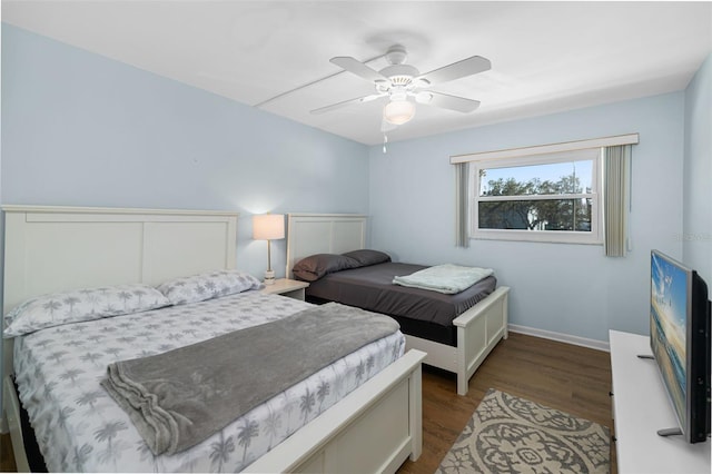 bedroom featuring ceiling fan and dark hardwood / wood-style floors