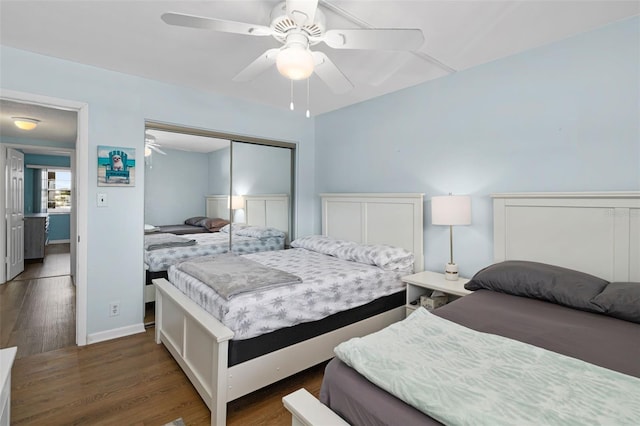 bedroom featuring a closet, ceiling fan, and dark wood-type flooring