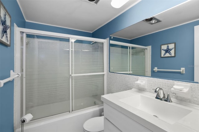 full bathroom with vanity, tasteful backsplash, enclosed tub / shower combo, and toilet