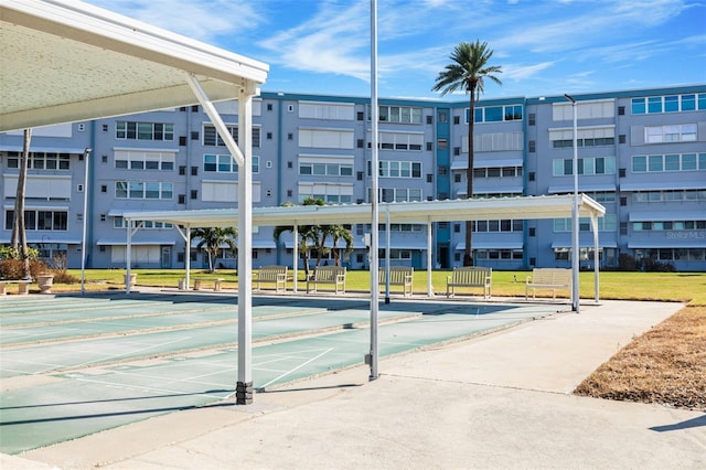 view of property's community with a yard