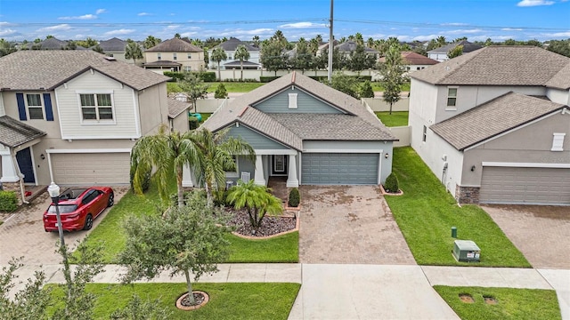 view of front of property with a front lawn and a garage