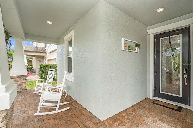 property entrance featuring covered porch