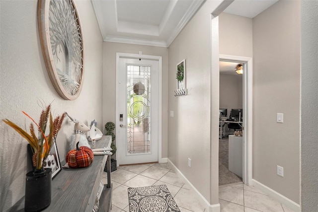 foyer entrance featuring crown molding and light tile patterned floors