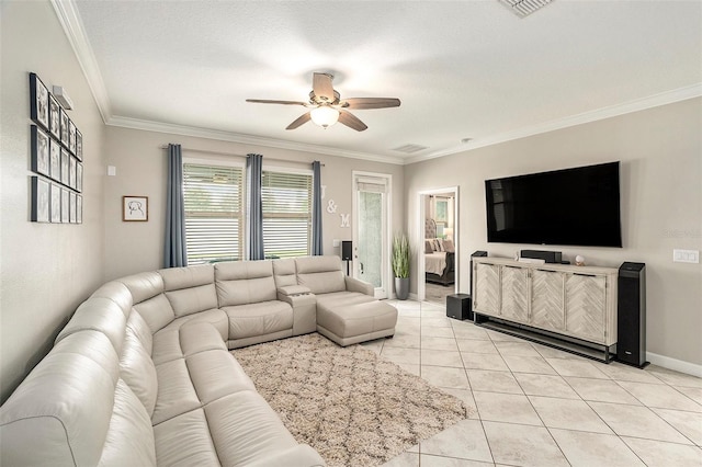 living room featuring a textured ceiling, crown molding, light tile patterned floors, and ceiling fan