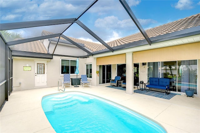 rear view of house featuring a patio and a lanai