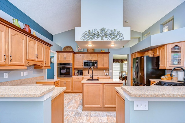 kitchen with sink, appliances with stainless steel finishes, kitchen peninsula, and high vaulted ceiling