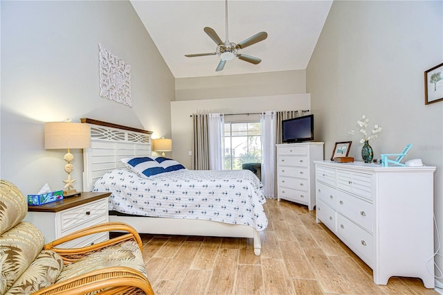 bedroom featuring high vaulted ceiling, light wood-type flooring, and ceiling fan