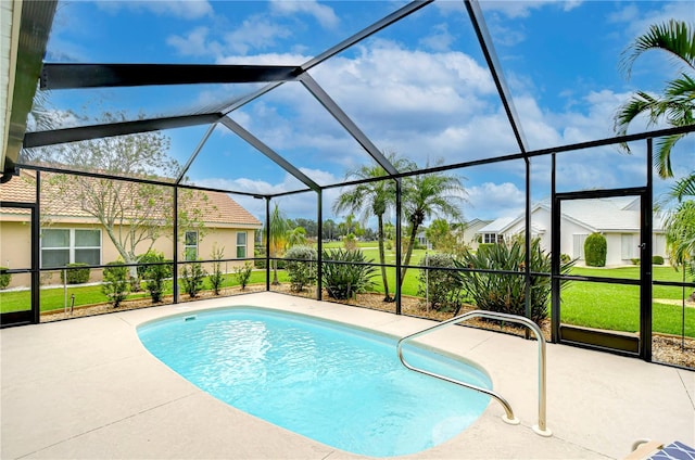 view of pool featuring a patio area, a lanai, and a lawn