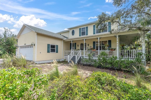 view of front of house with a porch and a garage