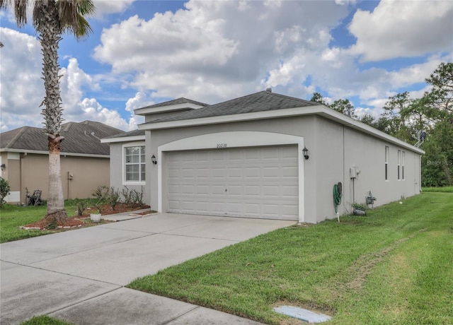 view of side of home featuring a yard and a garage