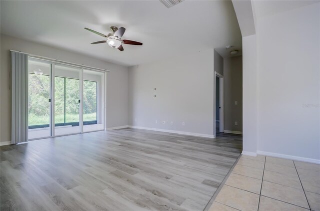 spare room with ceiling fan and light hardwood / wood-style flooring