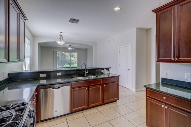 kitchen with ceiling fan, light tile patterned floors, sink, decorative light fixtures, and appliances with stainless steel finishes