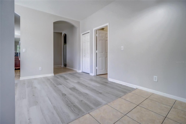 spare room with light hardwood / wood-style flooring