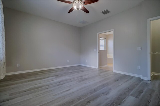 unfurnished room featuring ceiling fan and light hardwood / wood-style flooring