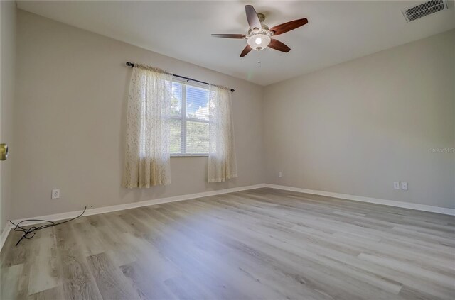 unfurnished room with light hardwood / wood-style floors and ceiling fan