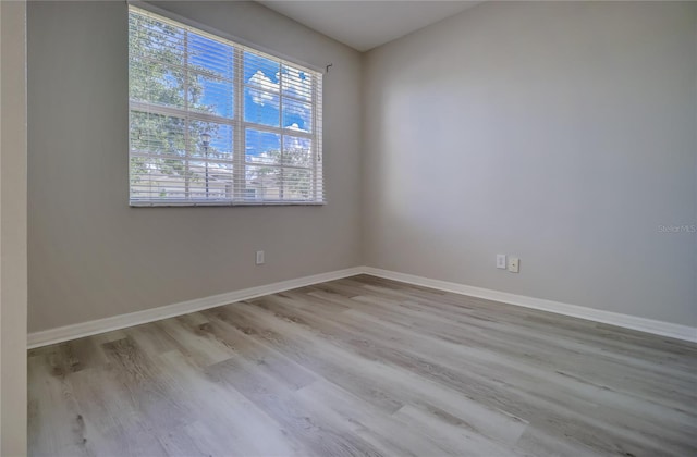 spare room with light wood-type flooring