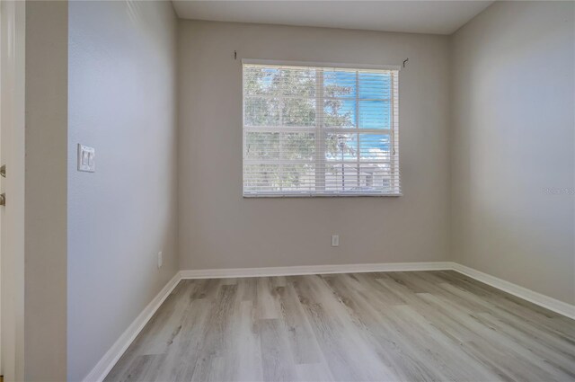 spare room with light hardwood / wood-style floors