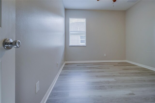 unfurnished room featuring ceiling fan and light hardwood / wood-style flooring