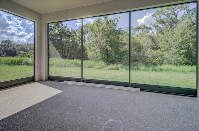 unfurnished sunroom with a wealth of natural light