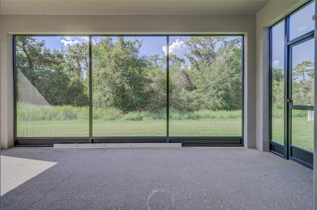 unfurnished sunroom with a healthy amount of sunlight