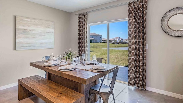 dining area with light tile patterned floors