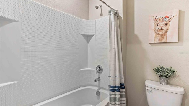 bathroom with toilet and shower / bathtub combination with curtain