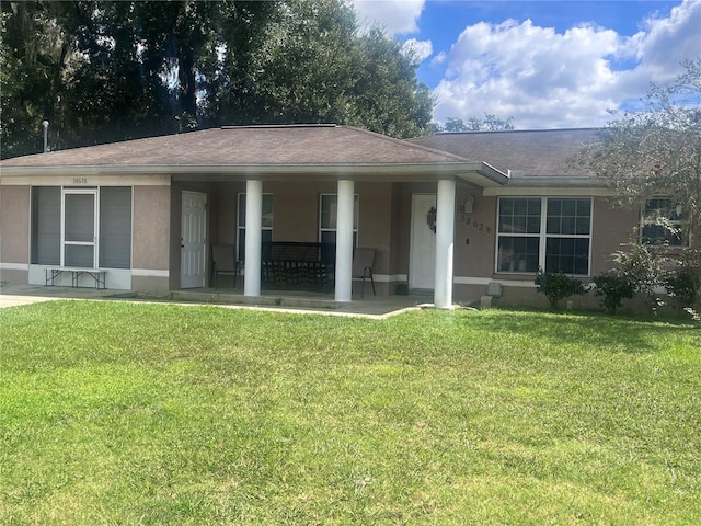 ranch-style home with a front lawn