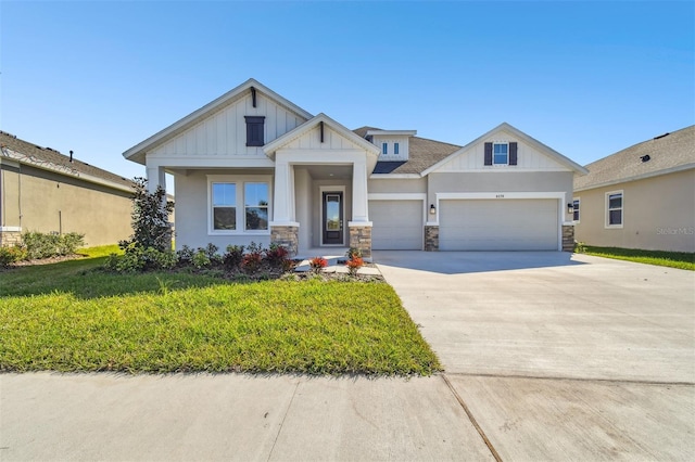 view of front of property featuring a garage and a front yard