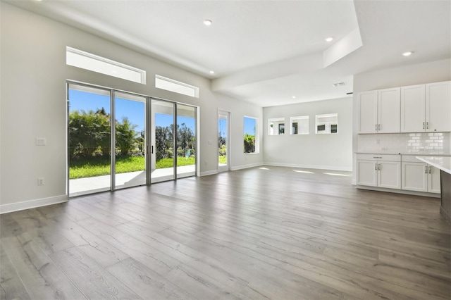 unfurnished living room with light hardwood / wood-style flooring