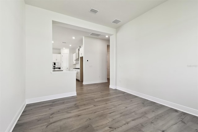 unfurnished room with hardwood / wood-style flooring