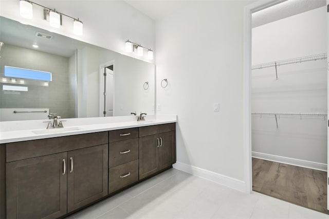 bathroom featuring tile patterned floors and vanity