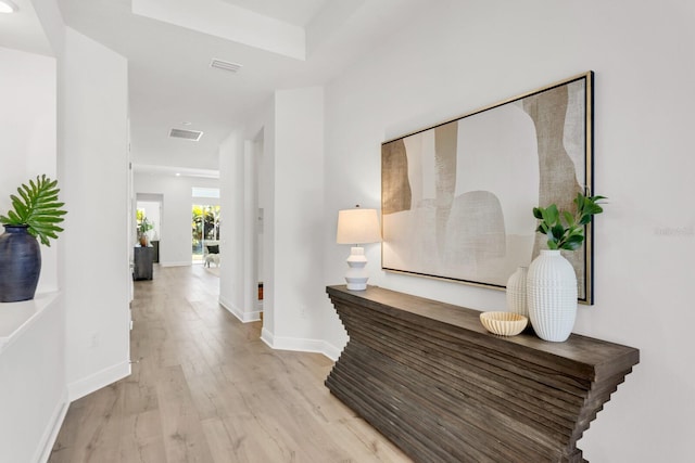 corridor featuring light hardwood / wood-style floors