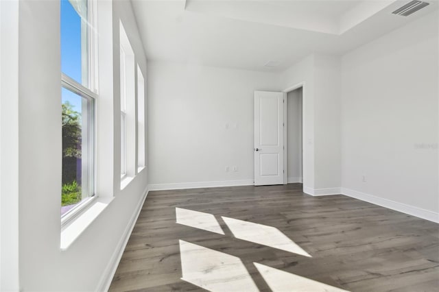 unfurnished room with dark hardwood / wood-style floors