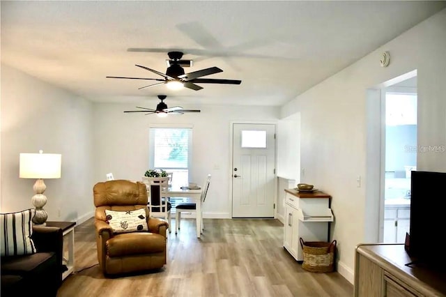 sitting room with light hardwood / wood-style flooring