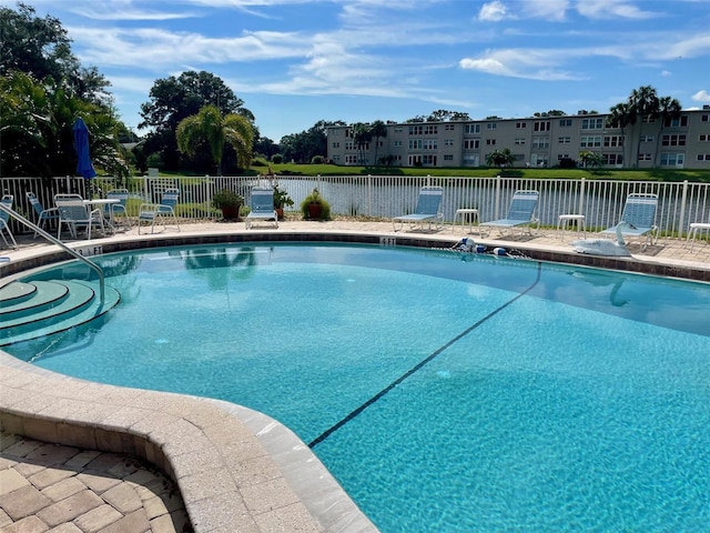 view of pool featuring a patio