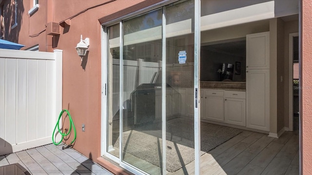 doorway to property featuring a wooden deck