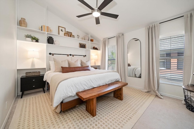 carpeted bedroom with lofted ceiling and ceiling fan