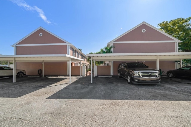 view of parking / parking lot with a carport