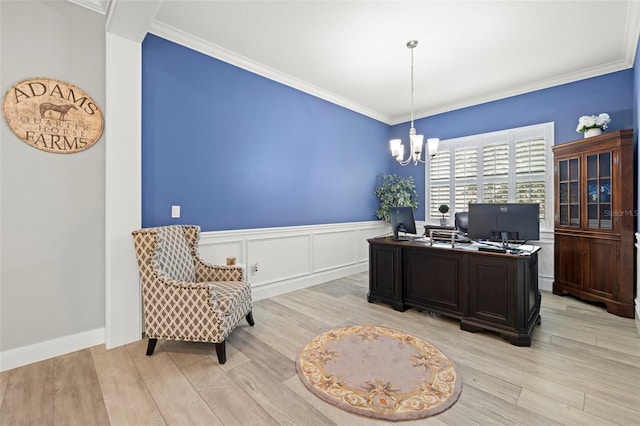 home office featuring a wainscoted wall, light wood finished floors, a decorative wall, ornamental molding, and a chandelier