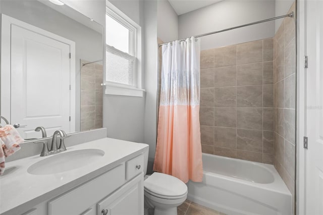 bathroom with toilet, tile patterned floors, shower / bath combo with shower curtain, and vanity