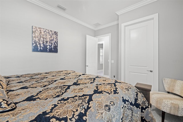 bedroom featuring visible vents and crown molding