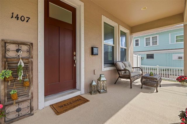 doorway to property with a porch