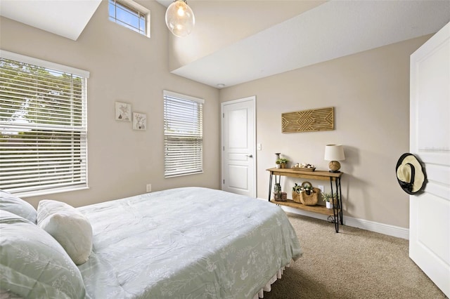 bedroom featuring multiple windows and carpet