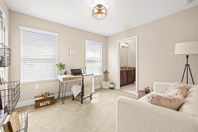 carpeted home office with baseboards