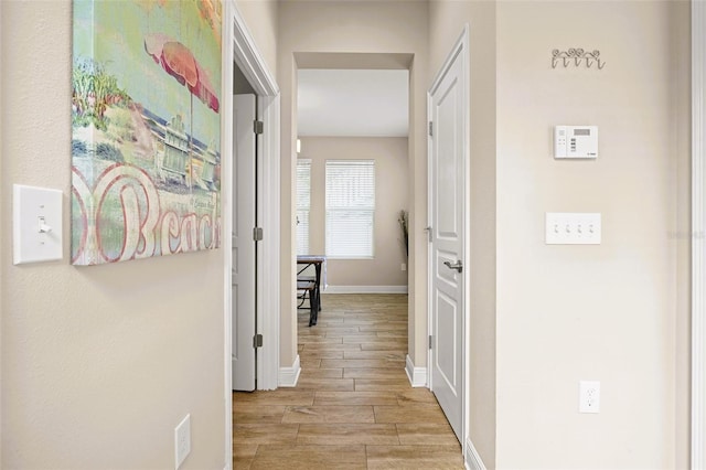 corridor featuring light hardwood / wood-style floors