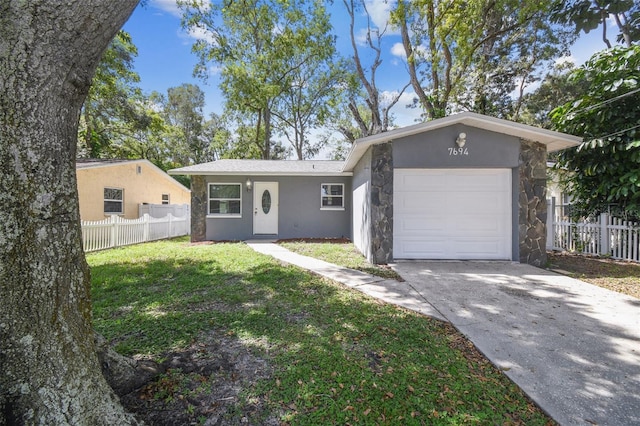 ranch-style house with a front yard and a garage