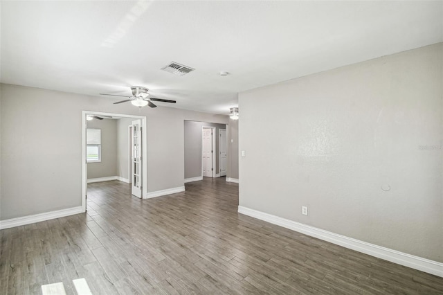 unfurnished room featuring hardwood / wood-style flooring and ceiling fan