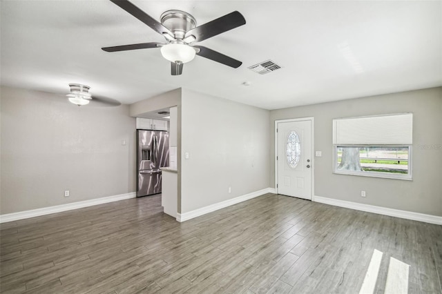 entryway with ceiling fan and dark hardwood / wood-style flooring