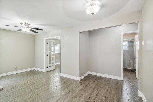 spare room with ceiling fan and hardwood / wood-style floors